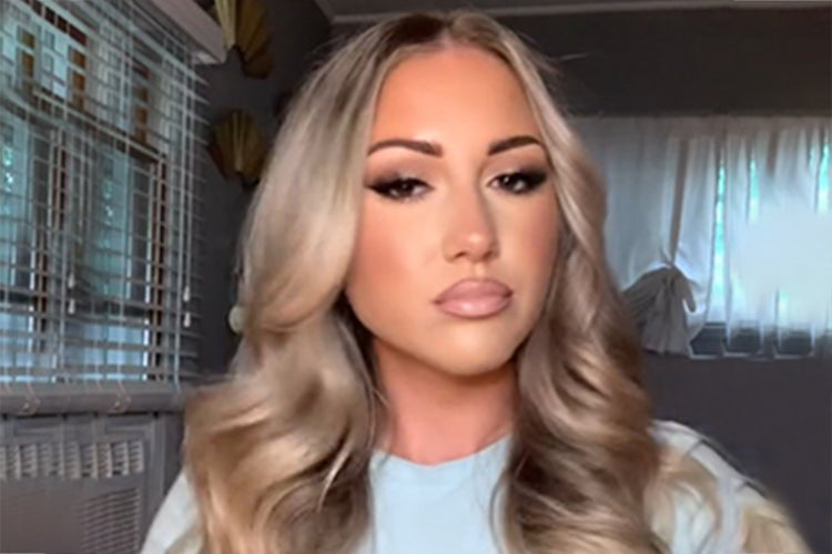 a woman with long blonde hair is shown in a video